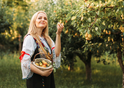 Women with basket of fruits in Serbia